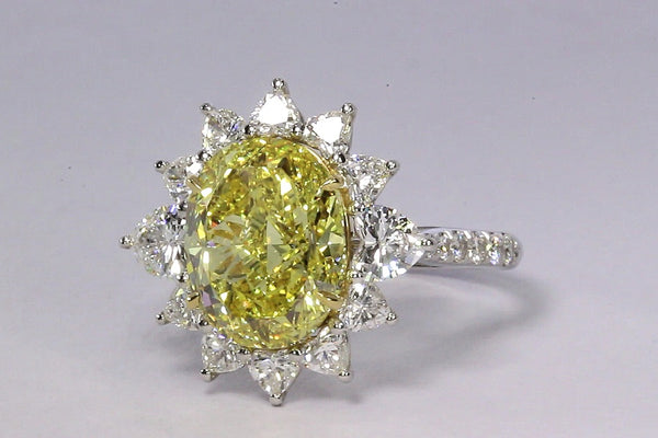 An Exceptional Unmounted Fancy Vivid Yellow Diamond